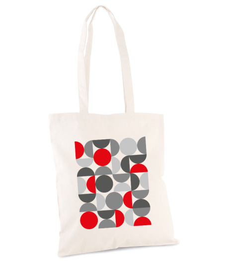 Bolsa de tela con un diseño abstracto de círculos rojos, grises y negros sobre fondo claro.